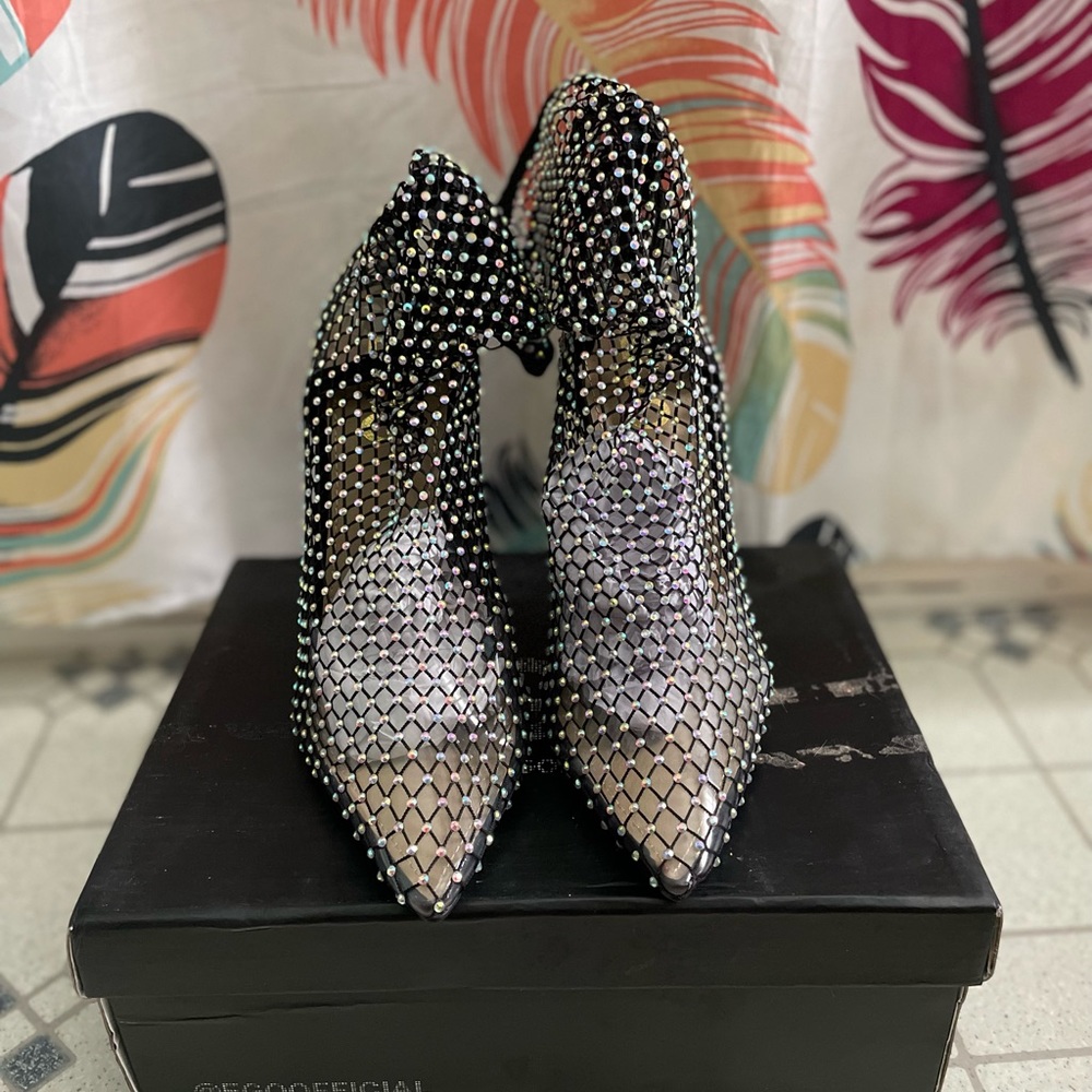 Jeweled black fishnet booties.